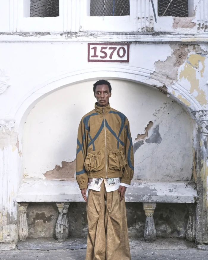 “Umoja” CUT-OUT POCKET NYLON JACKET 01